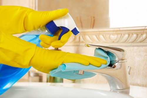 Staff member using protective measures in a carpet cleaning setting